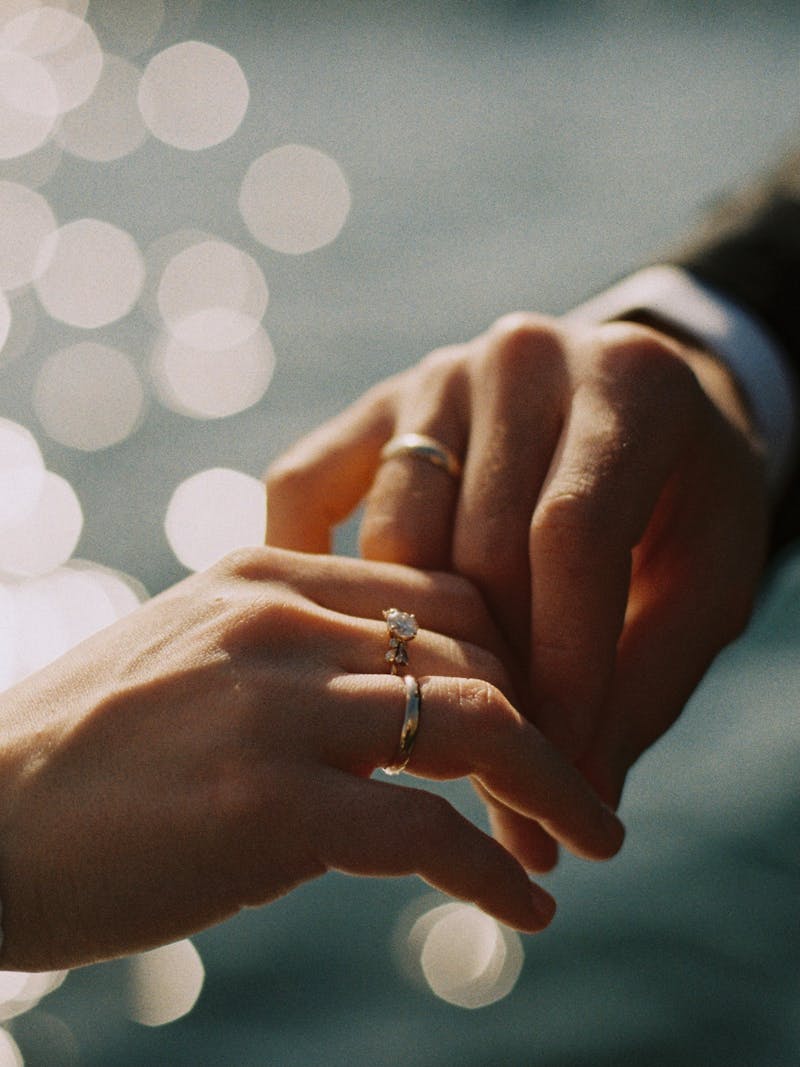 Couple hands with wedding rings